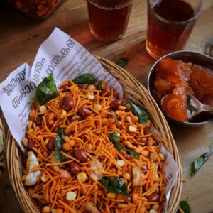 A tempting mixture of Indian snacks with drinks, showcasing vibrant textures and flavors.