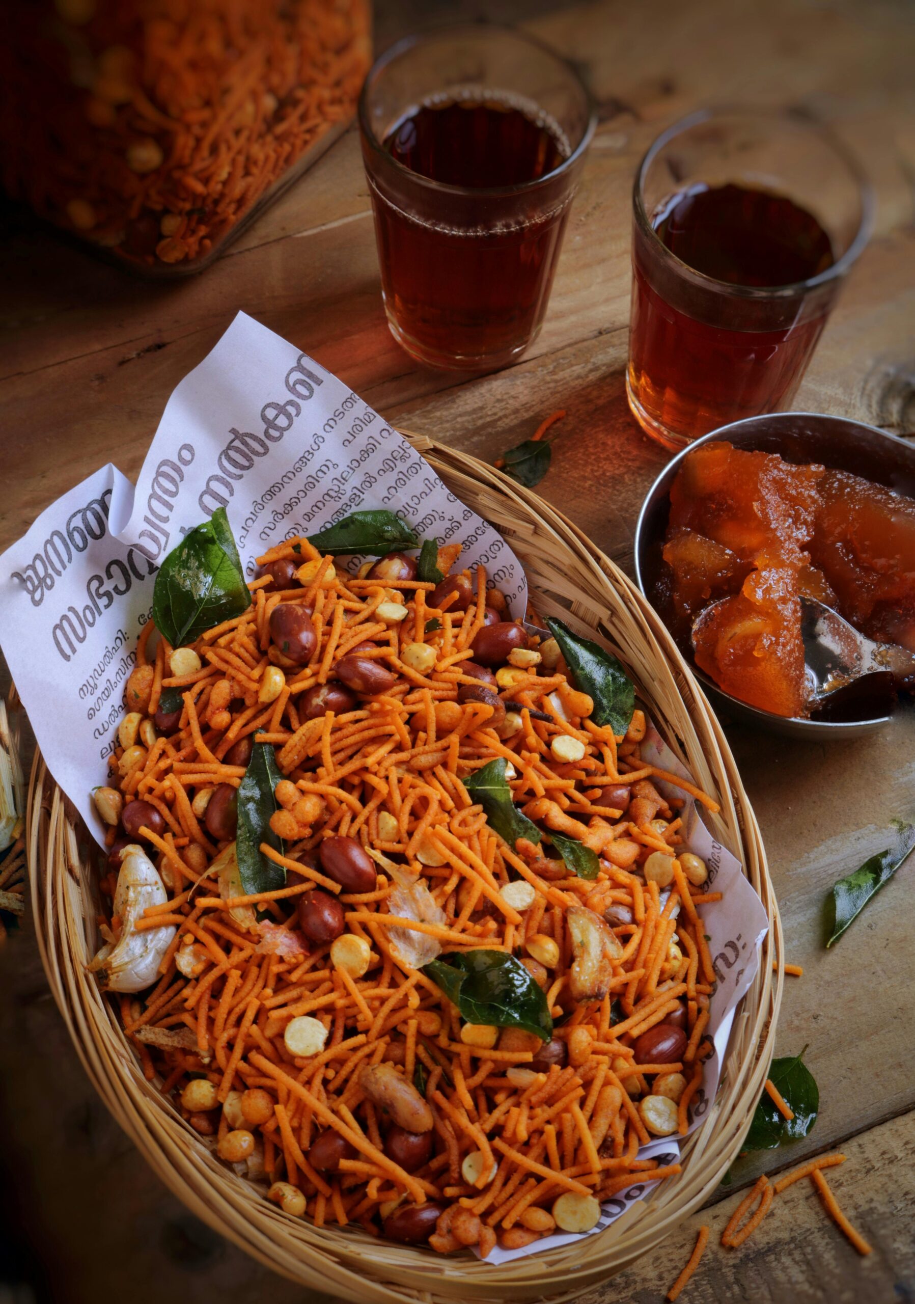 A tempting mixture of Indian snacks with drinks, showcasing vibrant textures and flavors.